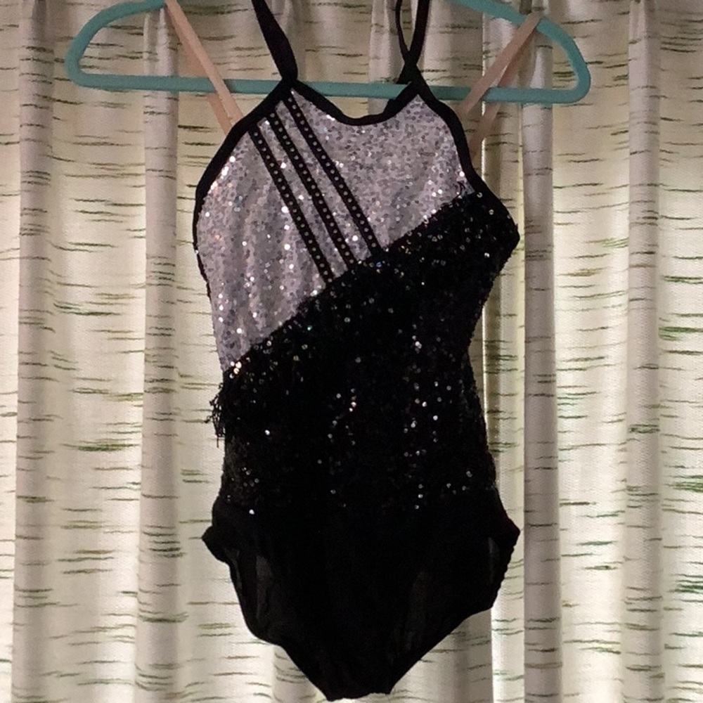 Sequin body suit with matching fringe shorts and wrist cuffs.